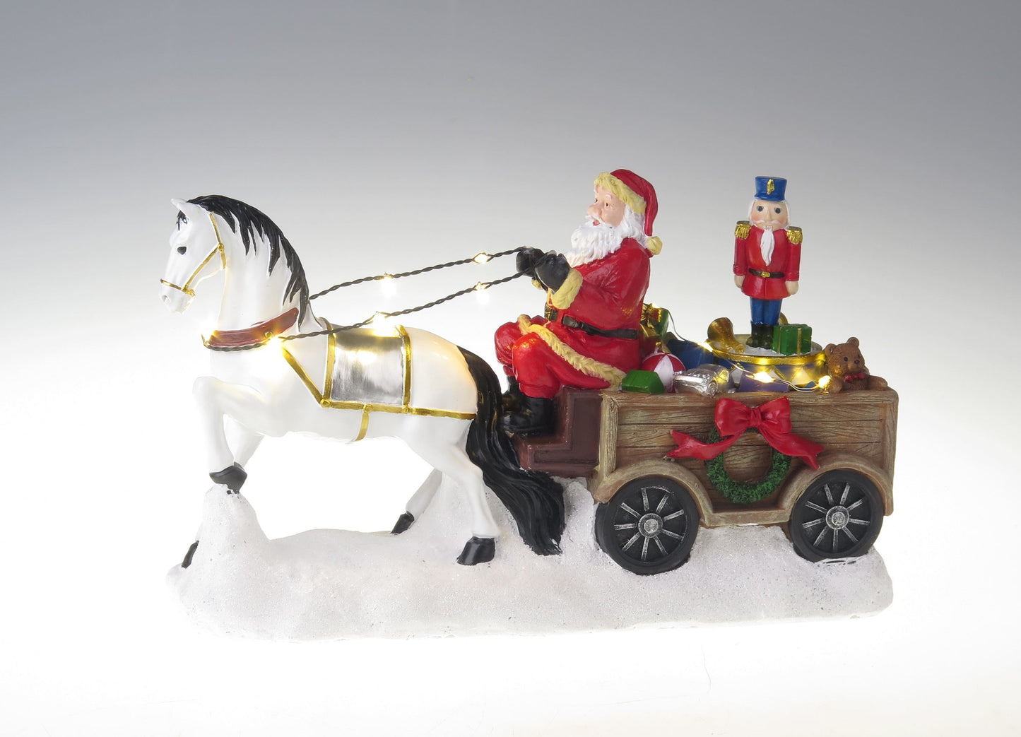 Père Noël avec cheval blanc, chariot et casse-noix rotatif